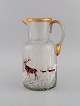 Legras Saint Denis. Russian beer jug in mouth blown art glass with hand-painted 
red deer in winter landscape. France, ca. 1900.
