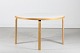 Alvar Alto (1898-1976)Two half tables of steam bent birch with lacquer and table top of ...