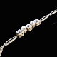 14k Yellow & 
White Gold 
Bracelet with 
Pearls and 
Diamonds. Total 
0,3ct.
Three 
brilliant cut 
...