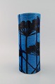 European studio ceramicist. Large vase in azure blue glazed stoneware with 
hand-painted flowers. 1960