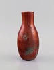 European studio ceramicist. Unique vase in glazed stoneware. Beautiful metallic 
glaze in shades of red. Mid-20th century.
