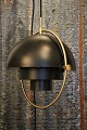 GUBI Multi-Lite Pendant lamp in black metal / brass designed in 1972 by Louis Weisdorf. The base ...