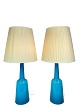 A pair of table lamps of blue opaline glass manufactured by Kastrup Glass Factory from around ...