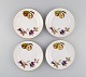 Royal Worcester, England. Four Evesham plates in porcelain decorated with fruits 
and gold edge. 1960s.
