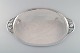 Colossal Georg Jensen Blossom serving tray in hammered sterling silver. Model 
2E. Dated 1915-1930.
