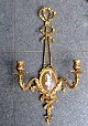 French wall 
applique in 
gilded bronze, 
Louis XVI 
style, 19th 
century. With 
plaquette of 
dancing ...