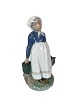 Royal 
Copenhagen 
porcelain 
figure, a 
Farming Girl, 
no.: 815.
22.5 x 14 x 
11.5 cm.
