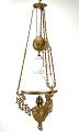 Large kerosene lamp of patinated brass and shade of white opaline glass from around the 1880s. ...