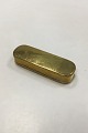 Brass Snufff 
box with 
decoration and 
text(wear). 
Measures 15 cm 
/ 5 29/32 in.