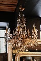 Fine, old French prism chandelier from around 1900 with cage-shaped crown with gilded wooden ...
