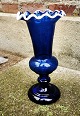 Blue floral 
glass vase with 
wavy white 
border. In 
perfect 
condition. 
Produced in the 
latter half ...