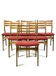 Six dining room chairs in dark polished wood and upholstered with red fabric, of Danish design ...