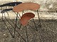 Small teak veneer tables with sloping metal legs. Danish modern from the 1960s. Largest table ...