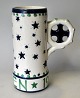 Aluminia mug, 
502/455. 
Christmas 1906, 
Copenhagen, 
Denmark. 
Decorated in 
blue and green 
with ...