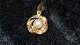 Gold pendant with pearl in 14 carat goldHeight with ax 24,18 mm15.86 mm wide in diaChecked ...
