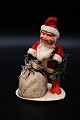 Old Santa Claus 
in sleeves, 
felt clothes 
and Christmas 
bag.
Height:15cm.