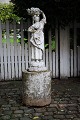 Romantic old French patinated sandstone figure of woman carrying a basket on her head. Height: ...