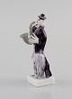 Peter Strang (b.1936) for Meissen. Figure in hand-painted porcelain. Saxophonist 
from the clown orchestra. Late 20th century.
