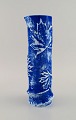 European studio ceramicist. Cylindrical vase in glazed ceramic decorated with 
maple leaves. Beautiful glaze in shades of blue. Late 20th century.
