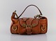 Vintage Mulberry handbag in core leather with brass clasps and buckles. 1980s.
