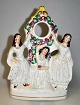 Staffordshire 
faience figure 
- watch holder 
- 19th century 
England. 
Imagining 3 
women at a tree 
...