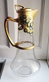 Art Nouveau style: Carafe in glass with engraved leaf ornamentation. Painted metal mounting with ...