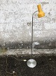 Floor lamp with 
yellow shade. 
Height approx. 
130 cm. Some 
dents on the 
foot.