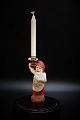 little old 
painted Santa 
Claus carrying 
a small 
Christmas 
candle.
Height: 12cm.