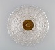 Orrefors wall / ceiling lamp in clear art glass and brass. 1970s.Diameter: 36 cm.Depth: 14 ...