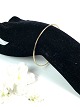 Bangle of 14 
carat gold. 
1.8 x 6.5 cm.
6.8 gram.
