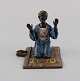 Antique cold-painted Vienna bronze shaped as praying man on a prayer mat. Early 20th ...