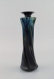 European studio ceramicist. Unique vase in glazed stoneware. Turned shape. 
Beautiful glaze in deep blue-green shades. 1920s / 30s.
