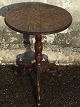 Small round side table, richly carved frame and plate. The plate with oak leaves and acorns. ...