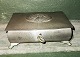 Charming Heuser 
Art Nouveau box 
in tin on four 
feet. On the 
lid decorated 
with a squirrel 
with ...