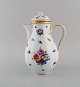 Antique Meissen porcelain chocolate pot with hand-painted flowers and gold 
decoration. Late 19th century.
