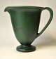 Herman A. Kähler jug, 20th century Næstved, Denmark. Green glazed on round base with handle. ...