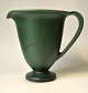 Herman A. 
Kähler jug, 
20th century 
Næstved, 
Denmark. Green 
glazed on round 
base with 
handle. ...