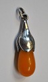 Necklace, art nouveau, Polished amber piece with silver montage, 20th century Denmark. Milky ...