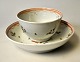 Chinese cup with saucer, 19th century. Hand-painted decorations with geometric patterns and red ...