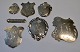 Collection of 7 coat stamps in silver, 19./20. century Denmark. 3.5 - 7.5 cm. in length.NB: ...
