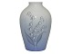 Bing & Grondahl 
vase with 
lilies of the 
valley.
The factory 
mark tells, 
that this was 
...