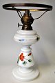 White opaline 
petroleum lamp 
with 
hand-painted 
enamel 
decorations 
with flowers, 
19th century. 
...