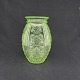 Height 20 cm.Rare uranium green press glass vase from Holmegaard Glassworks.The vase is ...