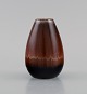 Carl Harry Stålhane (1920-1990) for Rörstrand. Vase in glazed ceramics. 
Beautiful metallic glaze in reddish brown shades. Mid-20th century.
