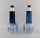 Ove Sandberg 
for Kosta Boda. 
Two table lamps 
in blue and 
clear art glass 
decorated with 
people. ...