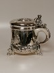 Onion mug of 
silver in 
baroque style 
on three ball 
feet with lion 
Onion with 
goose in the 
form ...