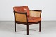 Illum Wikkelsø (1919-1999)Plexus Chair made of solid dark mahogany with patinated cognac ...