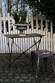 Old French café table in iron with a super nice dark patina. The table is finished and has a ...