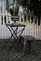 Old French café table in polished iron with a super nice dark patina.The table is finished and ...