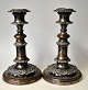 A pair of antique English telescopic candlesticks, 19th century silver-plated copper. Decorated ...